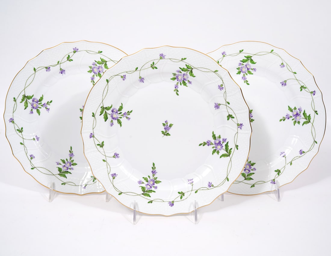 3 Herend Imola Flower Lilac 10.25" Plates: Three Herend #1524 Imola Flower Lilac Plates. Marked on bottom and measure 10.25"W. Condition report: no chips, minor wear, please see all photos. Contact C. Biddle Auction Gallery for more detailed i