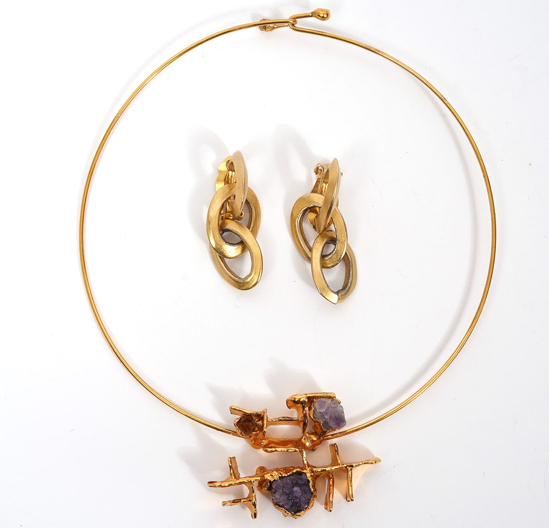 Gold Tone Earrings and Choker Necklace: Wearable art gold tone clip on earrings stamped DKC with detachable links and a gold tone choker necklace with brutalist style amethyst accent, measures 5" across. Condition report: good condition, pl