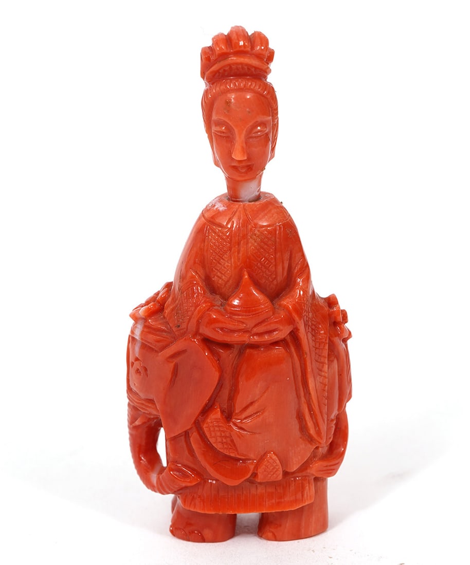 Chinese Carved Coral Figurine: Chinese carved coral of an elephant and standing buddah-like figure measures2 3/8"H x 1"W x .5"D. Condition report: the head has been reattached, please see all photos. Contact C. Biddle Auction Galle