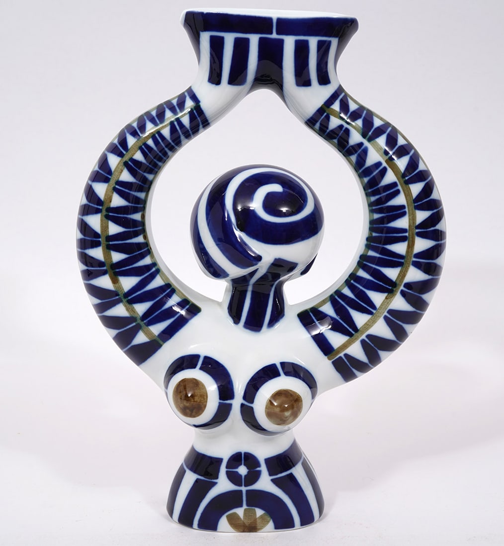 Sargadelos Botijo No. 8 Spanish Porcelain Figure: Sargadelos Botijo No. 8 Spanish porcelain figure. Feminine figure holding vessel decorated with blue and white geometric patterns. Measures 11.5"H x 8"W. Condition report: Good condition, please exami