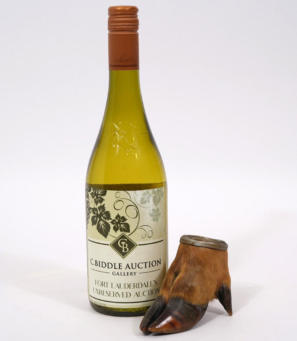 Elk's Foot/Hoof Ashtray: Elk's foot/hoof ashtray, measures 3.5"H x 4.5"W 20th Century. Condition report: Some oxidation to metal, please examine all photos closely. Contact C. Biddle Auction Gallery for more detailed informat