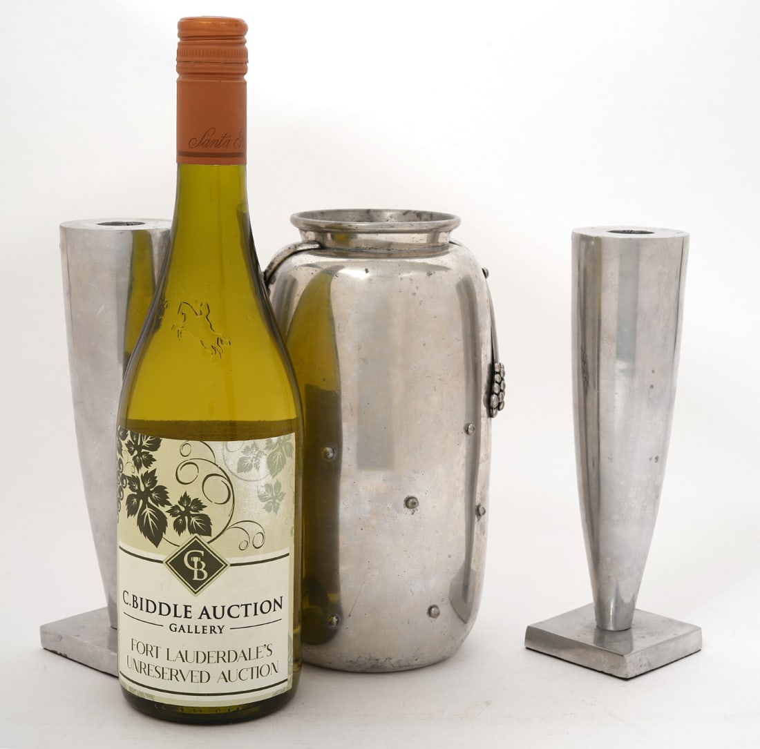 Fontier Pewter Vase & Graves Aluminum Candlesticks: Leon Fontier pewter vase (8.5"H x 4.5"W), pair of Michael Graves cast aluminum candlesticks (8"tall). Condition report: scratches and scuffs throughout, please examine all photos closely. Contact C. B
