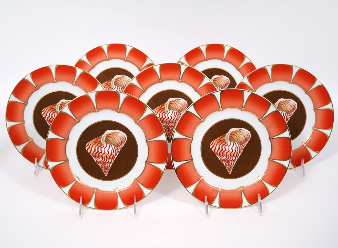7 Lynn Chase "Coquilles" Tiger Maurea Plates: 7 Lynn Chase "Coquilles Des Mers", Tiger Maurea version, porcelain salad/dessert plates (8.25"W). Part of a series of sea-life themed porcelain-ware to benefit the Chase Wildlife Foundation. Condition