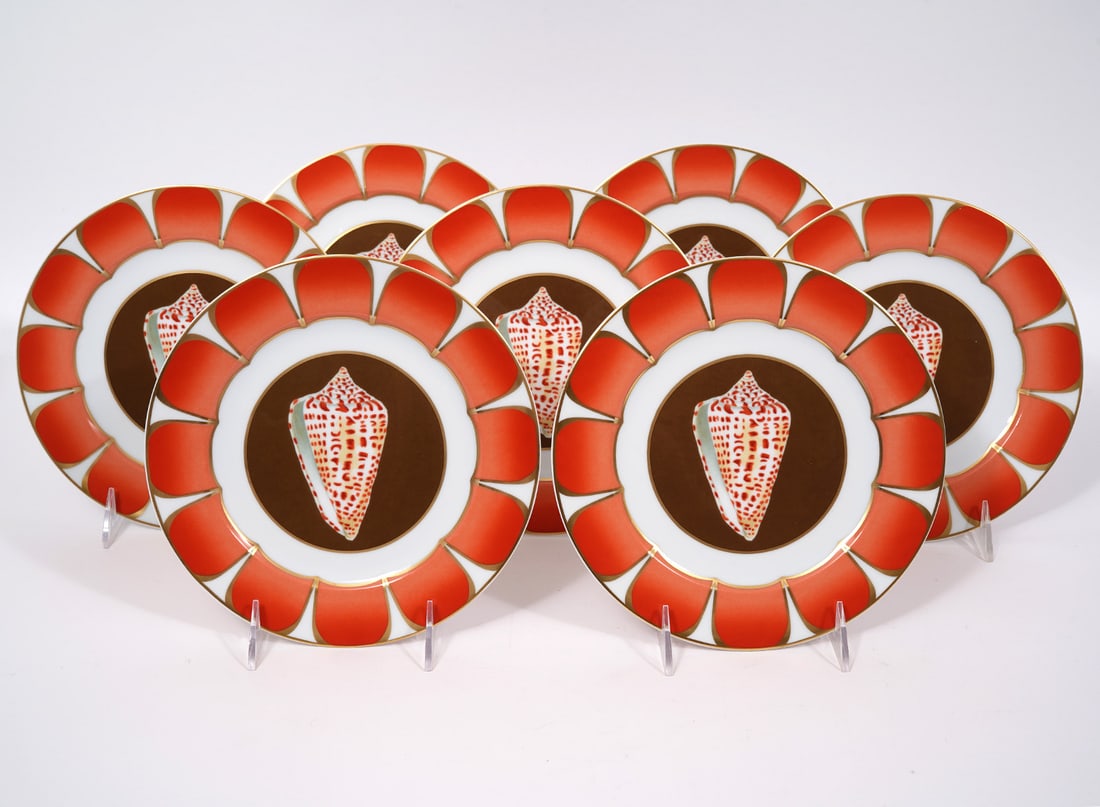 7 Lynn Chase "Coquilles" Alphabet Cone Plates: 7 Lynn Chase "Coquilles Des Mers", Alphabet Cone version, porcelain salad/dessert plates (8"W). Part of a series of sea-life themed porcelain-ware to benefit the Chase Wildlife Foundation. Condition r