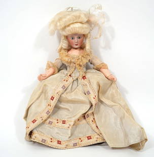 French Jumeau Porcelain Doll in Aristocratic Dress: French Jumeau porcelain doll in aristocratic dress. Measures approx 10". Condition report: Various wear, hair is not affixed. Please examine all photos closely. Contact C. Biddle Auction Gallery for m