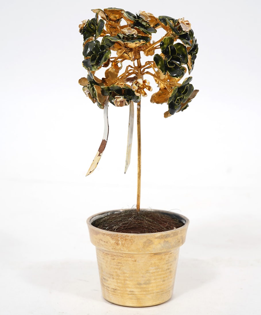 Cartier Sterling Pot With Enameled Flowers: Cartier sterling pot with enameled flowers and hanging white ribbon. Marked on bottom 'Cartier Sterling" Measures 5.25"H x 2 1/8"W. Condition report: some spots of enamel missing on ribbon, please see