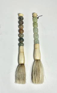 Two Chinese Carved Jade Calligraphy Brushes: Two Chinese hand-carved jade calligraphy brushes, featuring ornamental handles and long bristles. Each measures approx. 11" long. Condition report: Good condition, please examine all photos closely.