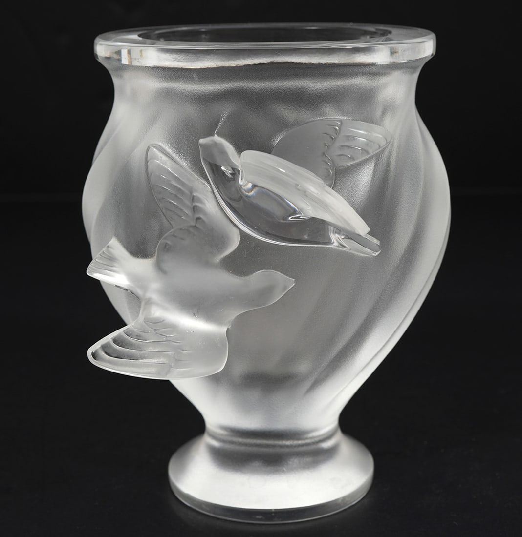 Lalique Crystal 'Rosine' Flower Vase: Lalique crystal 'Rosine' flower vase features 2 Rosine birds in flight on the outside center of the vase. Measures 5"H x 4"W (incl. birds) x 4"L; opening of vase 2.5"L x 1 7/8"W. Condition report: goo