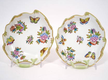 Pr Herend Queen Victoria Green Leaf Dishes: Pair of Herend Queen Victoria green leaf dishes with gilt rims and green handles. Marked on underside #204/VBO. Measures 7.5"L x 7"W x 1.5"H (2.5"H handle). Condition report: good condition, please se