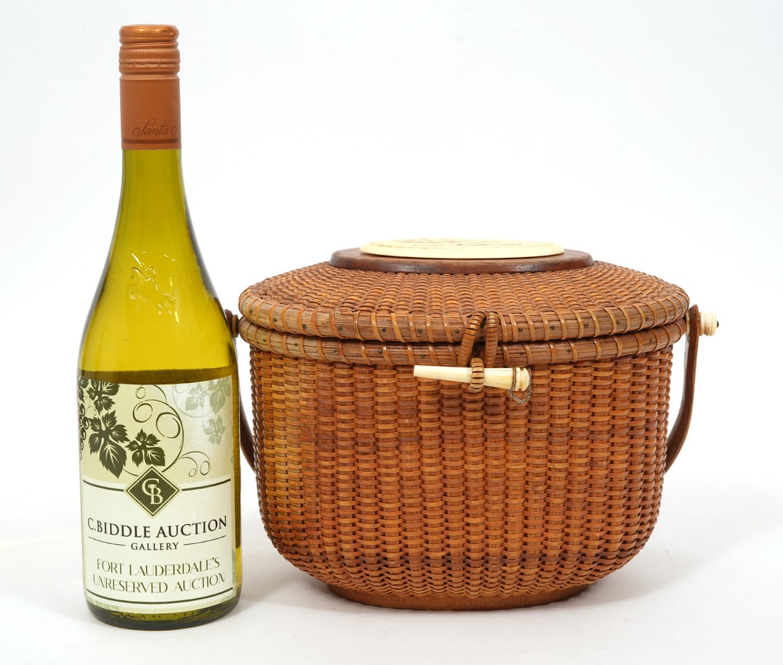 Mike Kane Nantucket Basket Purse w/ Scrimshaw: Mike Kane Nantucket basket purse with scrimshaw medallion on top and a penny inside the purse. Underside reads "MADE BY / MIKE KANE / 1973 / NANTUCKET / ISLAND". Measures 10.5" x 7.5"H. Condition repo