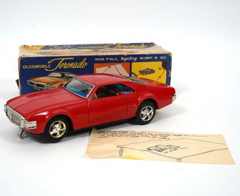 Two Japanese Toy Toronado Mystery Bump' N Go Cars