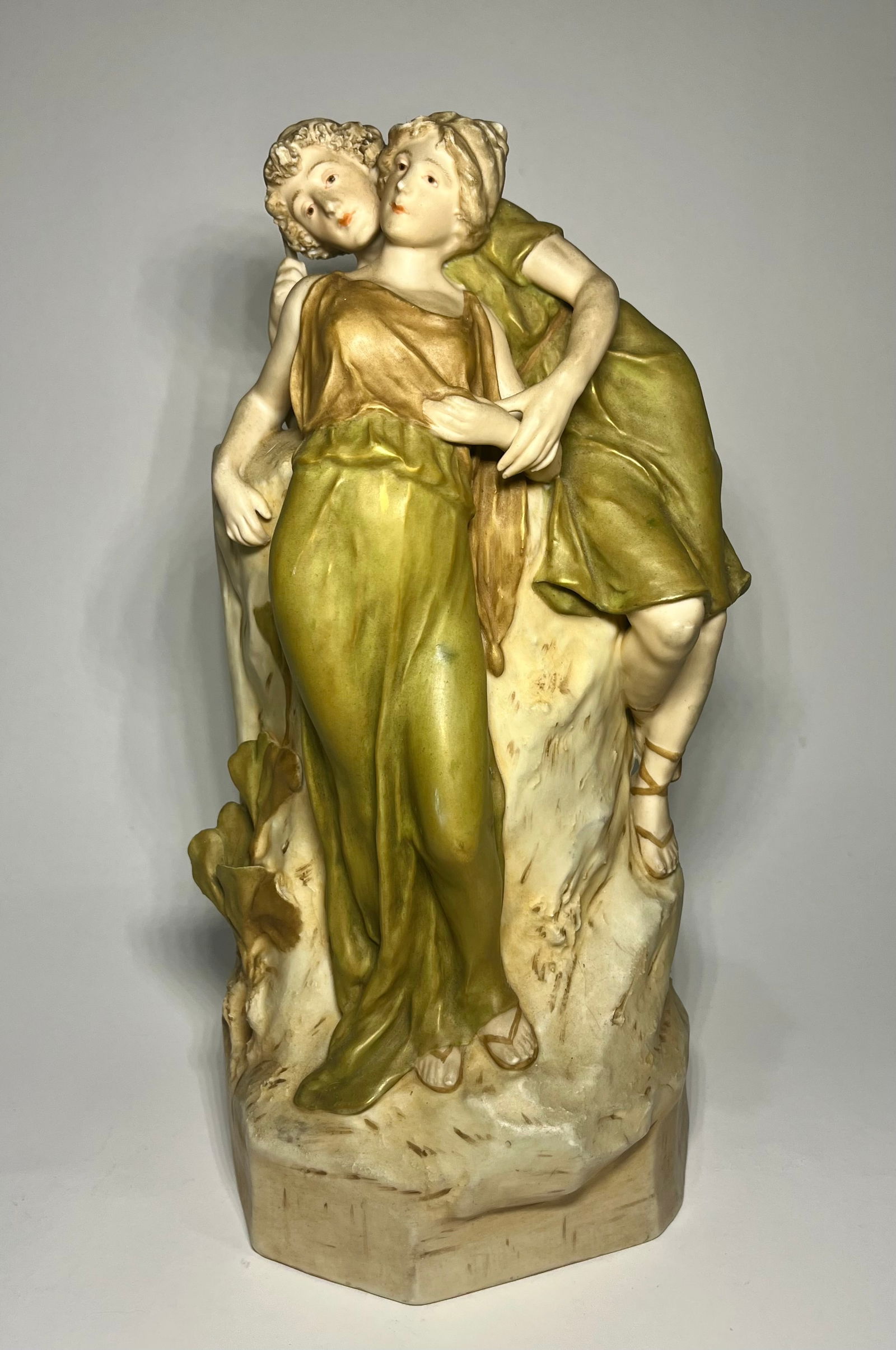 Royal Dux 'Romantic Couple' Porcelain Vase: Royal Dux Bohemian porcelain sculptural vase features a couple in a romantic pose and is hallmarked underside. Measures 14.5"H x 7"W. Condition report: Good condition, please examine all photos closel