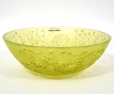 Lalique Crystal Bucolique Dandelion Bowl: Lalique Crystal Bucolique Dandelion Bowl is decorated with engraved dandelions around the exterior and the bowl is raised on 3 small feet. There is a 'Lalique Paris label on the inside near the top ri