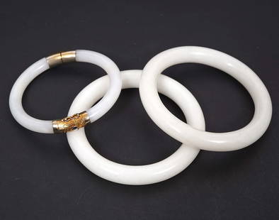 3 White Chinese Jade Bangle Bracelets: 3 Chinese White Jade Bangle Bracelets, a pair each 8mm diameter & 1 with gold tone hinge & clasp 7mm diameter. Condition report: Good condition, please examine all photos closely. Contact C. Biddle Au