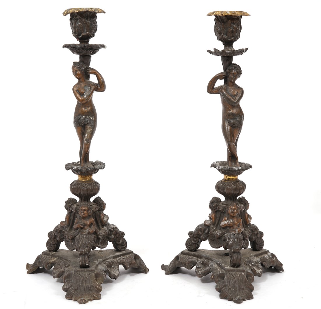 Italian Renaissance-Revival Bronze Candlesticks: Italian Renaissance-Revival bronze candlesticks features female figures and cherubs with scrolling acanthus leaves. Measures 14"H x 7"W. Condition report: Good condition, common wear for age, please s