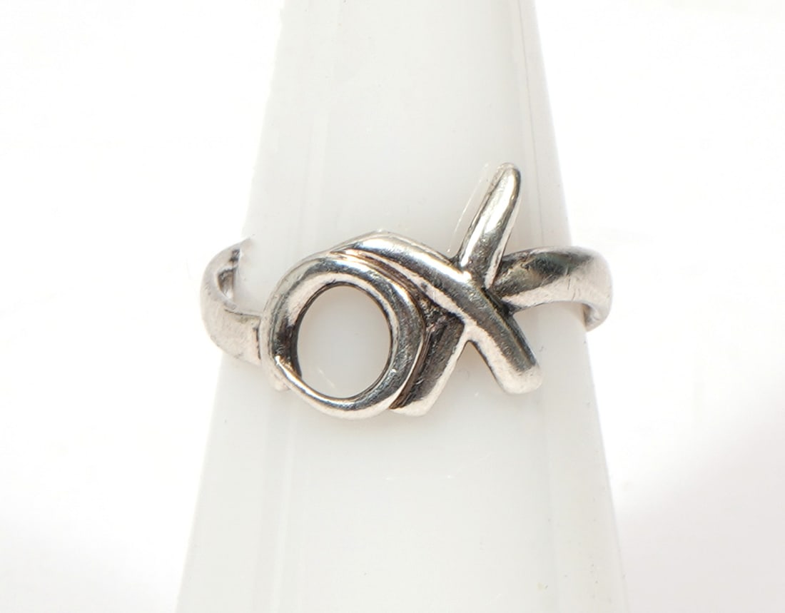 Tiffany & Co. Paloma Picasso Sterling XO Ring: Paloma Picasso for Tiffany & Co. sterling silver 'XO' ring, size 5. Total weight - 1.9g. Condition report: Good condition, please examine all photos closely. Contact C. Biddle Auction Gallery for more