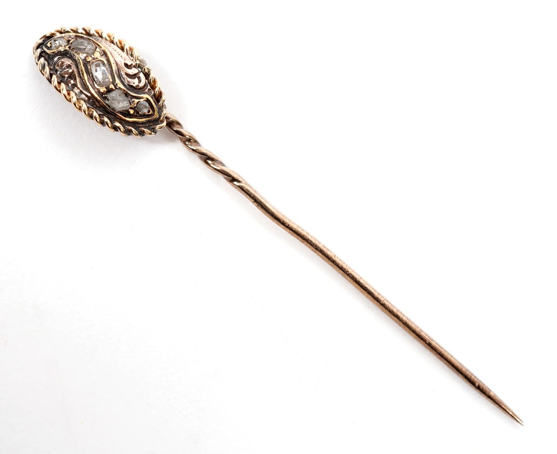 9K YG and Diamond Stick Pin: 9K yellow gold and diamond stick pin features rope style frame and twist stem. Approx 2.25" long. Weight - 1.7g. Condition report: Good condition, please examine all photos closely. Contact C. Biddle 