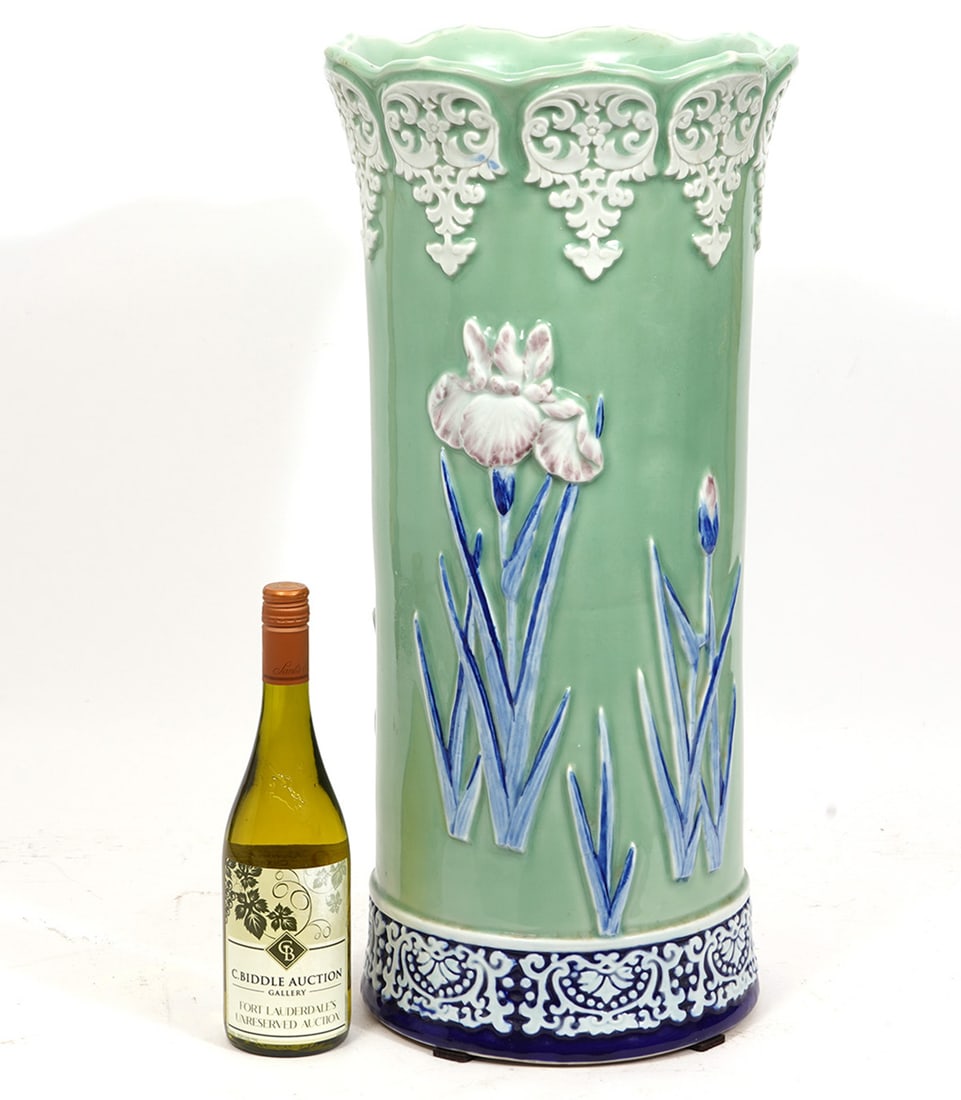 Chinese Porcelain Umbrella Stand: Oriental-Style porcelain umbrella stand, features overall floral motif. Measures 25"H x 11"W. Condition report: Good condition, please see all photos. Contact C. Biddle Auction Gallery for more detail