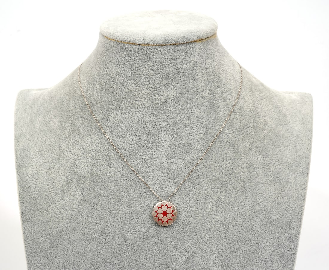 Paloma Picasso Tiffany & Co Heart Pendant Necklace: Paloma Picasso for Tiffany & Co hearts pendant necklace. Pendant features array of repeating hearts with red enamel on a 15" long chain and is hallmarked on clasp. Weight - 6.4g. Condition report: Goo