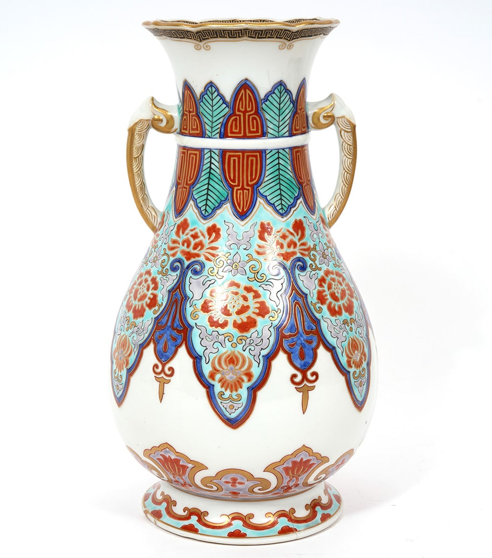 Chinese Floral Double Handle Vase Signed: Chinese floral double handle vase, features repeating floral designs in orange, red, green and blue with gold accents on handles and rim. Signed four character mark on underside and measures 10.5"H x 