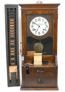 Cincinnati Time Recorder Co. Time Clock: Cincinnati Time Recorder Co. Company time clock, in oak case. Includes rack with paper punch cards, and key. Measures 16"L x 12"W x 35"H. Rack measures 35.5"H x 5.25"W. Condition report: Good conditio
