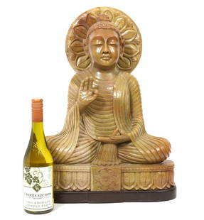 Large Carved Soapstone Buddha Sculpture: Large carved buddha figure in the vitarka mudra position. Sits on custom wood base. Measures 15"L x 6"W x 21"H, (1.5" base). Condition report: Good condition, please see all photos. Contact C. Biddle