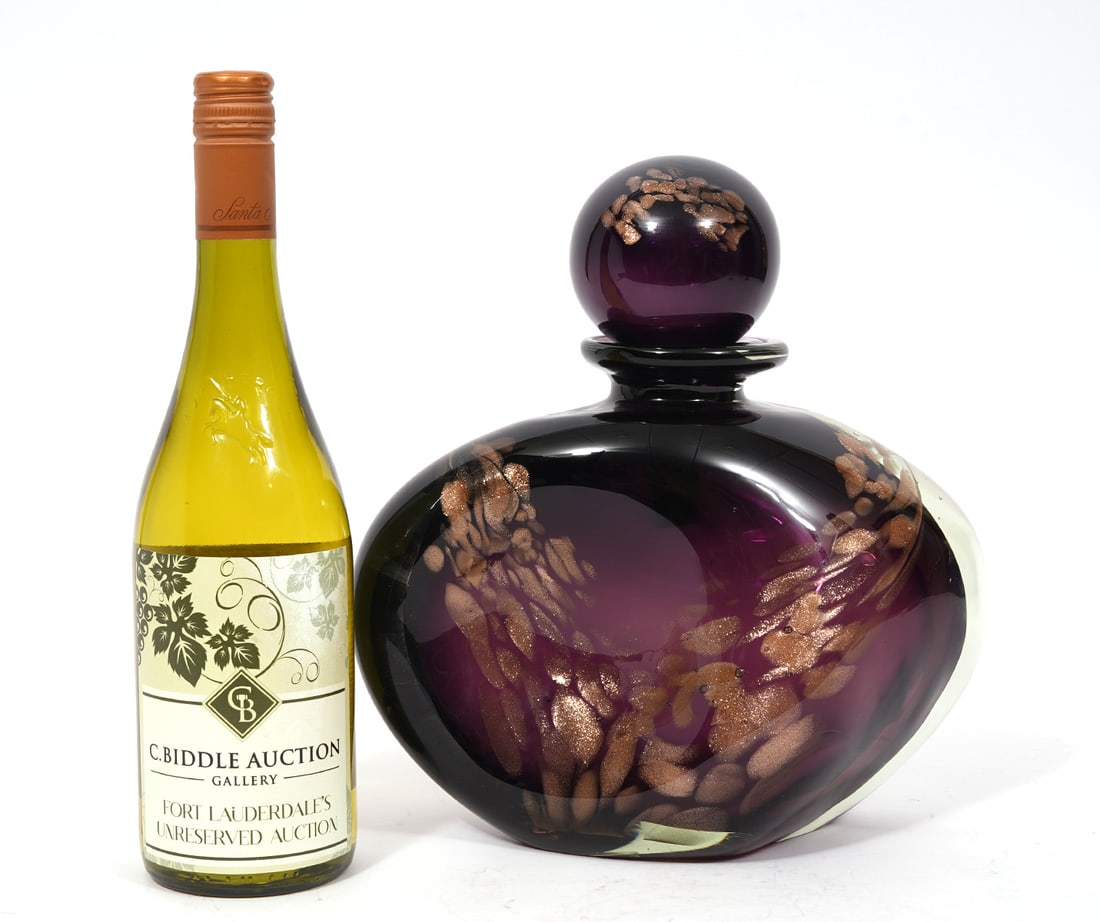 Michele Luzoro French Art Glass Perfume Bottle: Michele Luzoro French art glass perfume bottle, dark amethyst with gold flecks, pinched sides, signed underside. Measures 10.5"H x 9.75"W. Condition report: Good condition, please see all photos. Cont