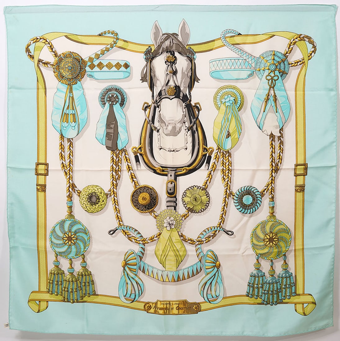 Hermes Paris "Fronteaux et Cocardes" Silk Scarf: Hermes Paris "Fronteaux et Cocardes" silk scarf designed by Caty Latham has a horse and ribbon motif and measures approx. 35" x 35" (90cm x 90cm). Condition report: Good condition, please examine all