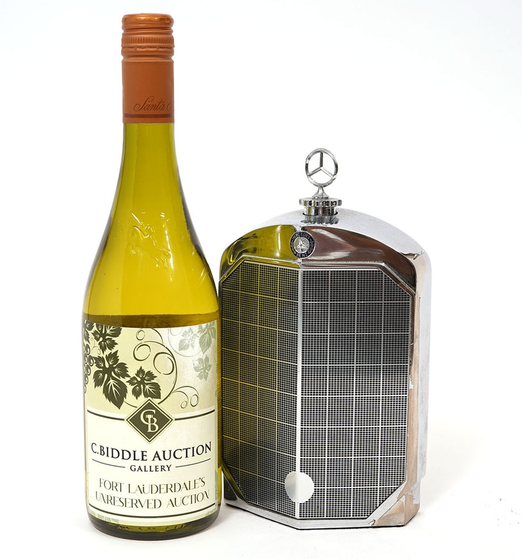 Mercedes Benz Rudd Speed Chrome Flask: Mercedes Benz automobile Rudd Speed chromium plated flask. Measures 5"L x 2.5"W x 8.5"H. Condition report: Minor plating loss and wear, please examine all photos closely. Contact C. Biddle Auction Gal