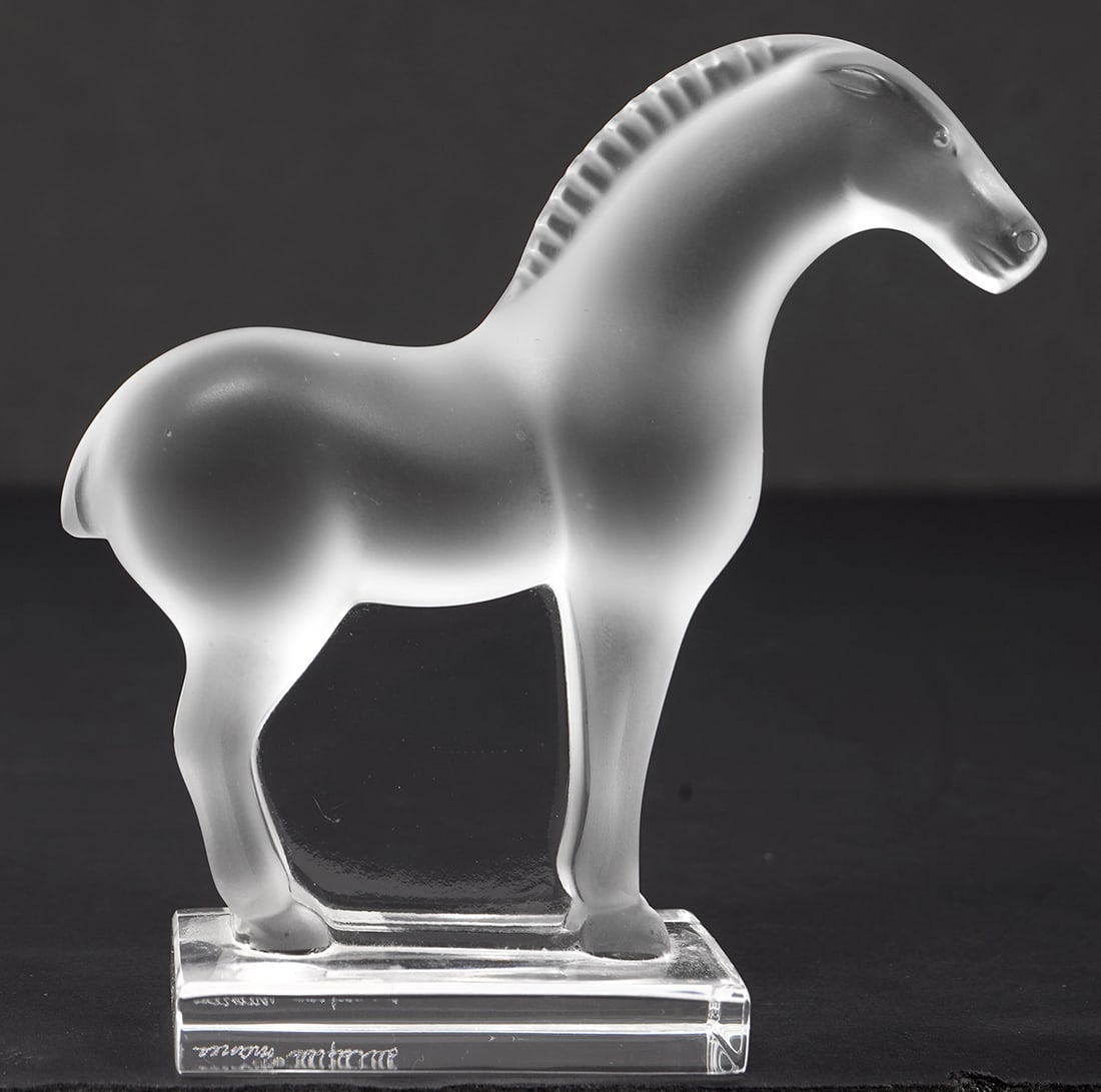 Lalique Frosted Crystal Tang Horse Figurine: Lalique frosted crystal Tang Horse figurine on a clear crystal base and etched on side of base 'Lalique France'. Measures 3.75"H x 3.5"L. Condition report: good condition, please see all photos. Conta