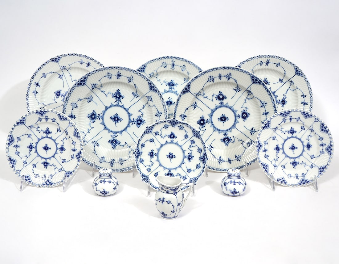 11 Pcs Blue Fluted Half/Full Lace Royal Copenhagen: 11 pcs Blue Fluted Half/Full Lace Royal Copenhagen includes 5 dinner plates that measure 10’’ W, 1 saucer 6.5’’ W, 2 bread & butter plates 7’’ W, small creamer 3.25"H x 3"W; salt & pepper