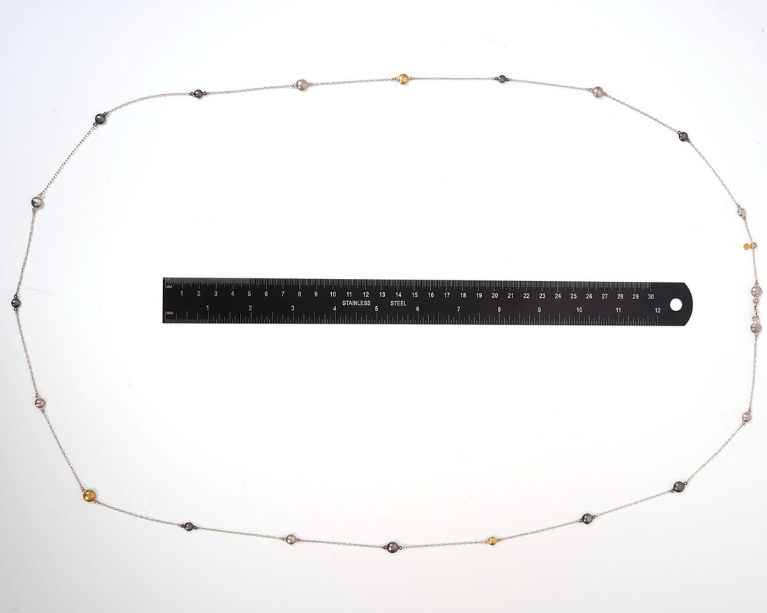 Gurhan Tri-Color Sterling & 24K Necklace: Gurhan tri-color sterling silver and 24K yellow gold necklace. Features 4 and 5 mm round stations, in silver and 24K gold, measures 48" total length and is hallmarked on gold tag. Total weight - 16.7g