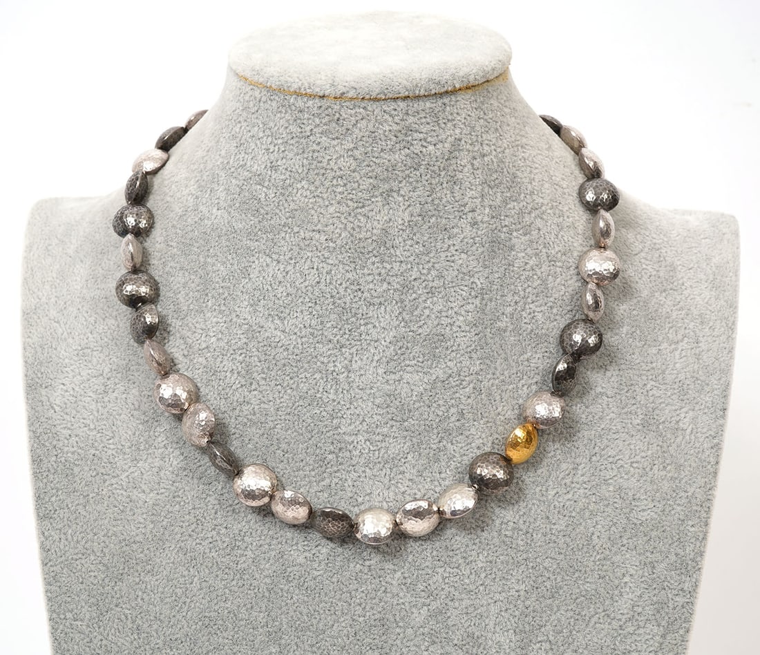 Gurhan Sterling Silver 24K Gold Beaded Necklace: Gurhan sterling silver and 24K yellow gold hammered round beads (12mm) necklace. One bead is 24K yellow gold and hallmarked on lobster clasp. Measures 18" long. Weight - 56.7g. Condition report: Good