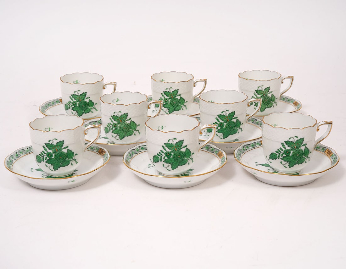 8 Herend Chinese Bouquet Green Demitasse & Saucers: 8 Herend Chinese Bouquet Green demitasse cups (2"H x 3"W) and 8 matching saucers (4.5"). Stylized with peony designs surrounded by garlands of leaves with 24K gold trim, accents and scalloped rim. Con