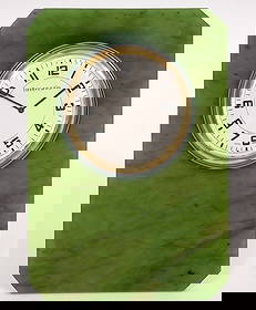 Tiffany &. Co. Art Deco Jade Easel Back Desk Clock: Tiffany & Co. art deco desk clock with enamel trim is set in rectangular shaped green jade with brass easel back. Marked Tiffany & Co. on clock face and on back Swiss Made 5825. Measures 4.5"H x 3"W;