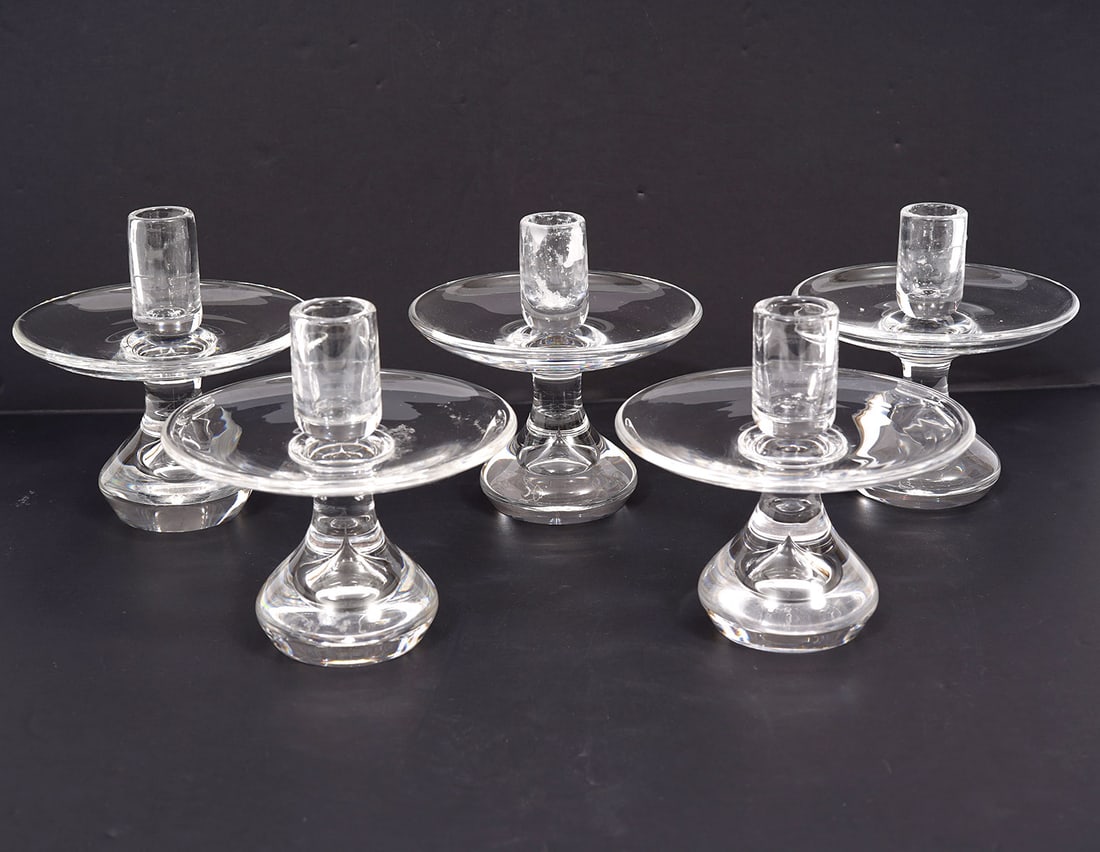 Five Vintage Steuben Clear Crystal Candle Holders: Five vintage Steuben clear crystal candle holders, etched 'Steuben' on bases. Measure 5.25"H x 5"W. Condition report: good condition, please see all photos. Contact C. Biddle Auction Gallery for more