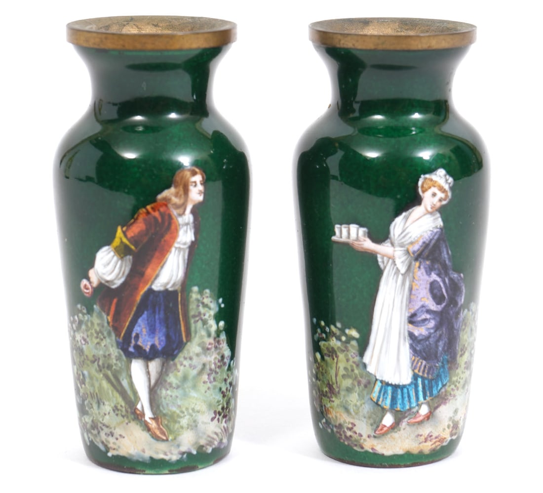 Pair of Miniature Enameled Vases: Pair of miniature enameled vases on green ground with gilt rims features a male image on one and female on the other and signed near the bottom 'Breton'. Measures 3"H x 1.25"W. Condition report: good 