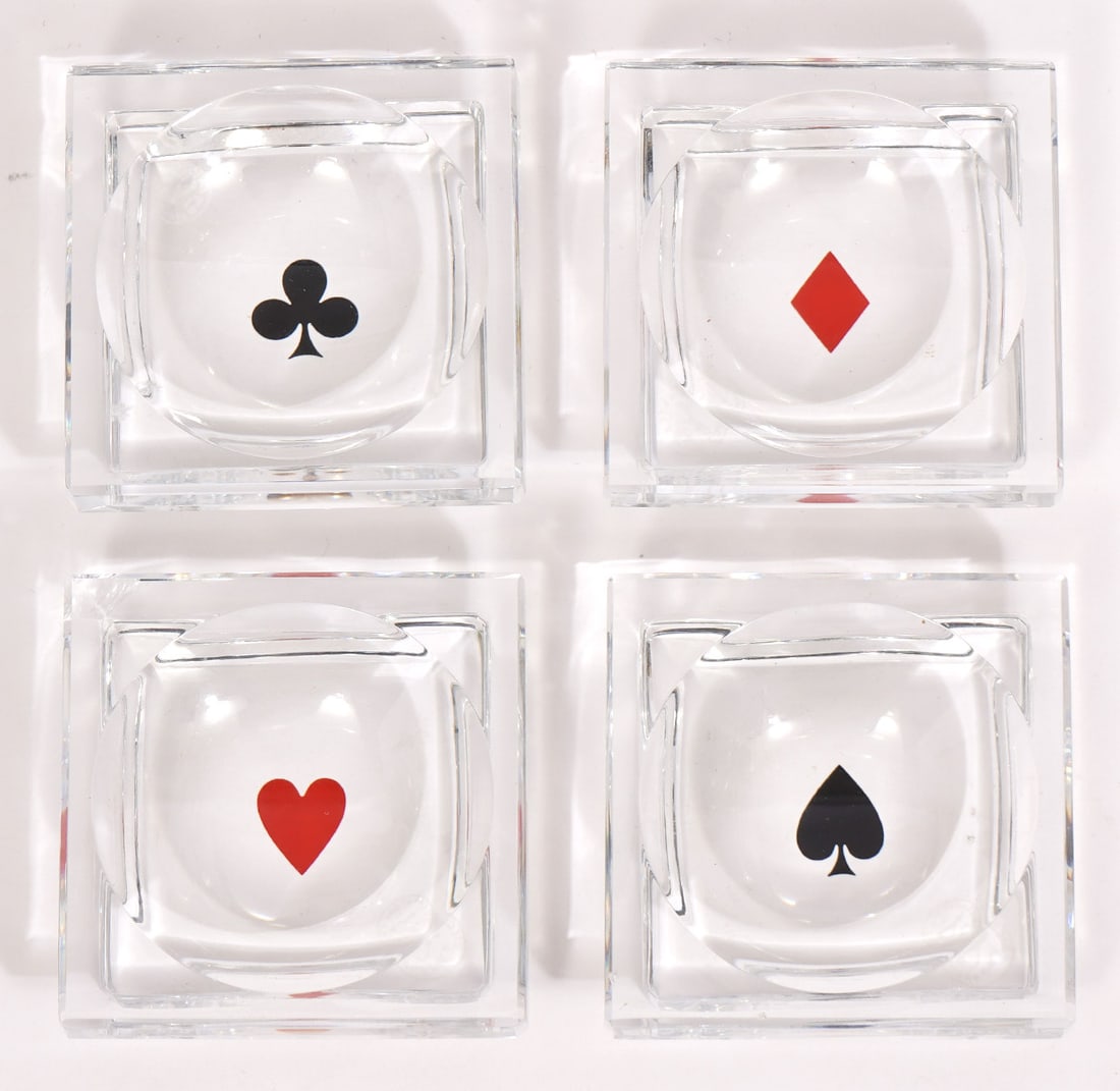 4 Baccarat Crystal Trays with 4 Card Suits: 4 Baccarat small square crystal trays, each one decorated with a symbol from a deck of cards ~ heart, diamond, spade and clover. They are marked Baccarat on underside. Measures 2.5"L x 2.5"W x .75"H.