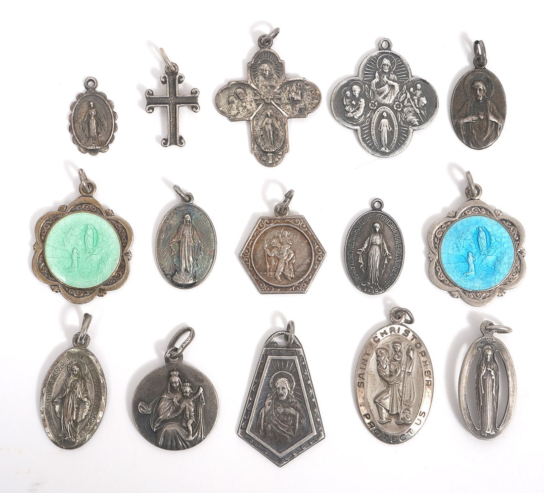 Group of 15 Silver Catholic Charms: Group of 15 silver Catholic charms includes images of saints and iconography. Charms range from 0.5" to 1". Total weight - 40.4g. Condition report: Good condition, please examine all photos closely. C