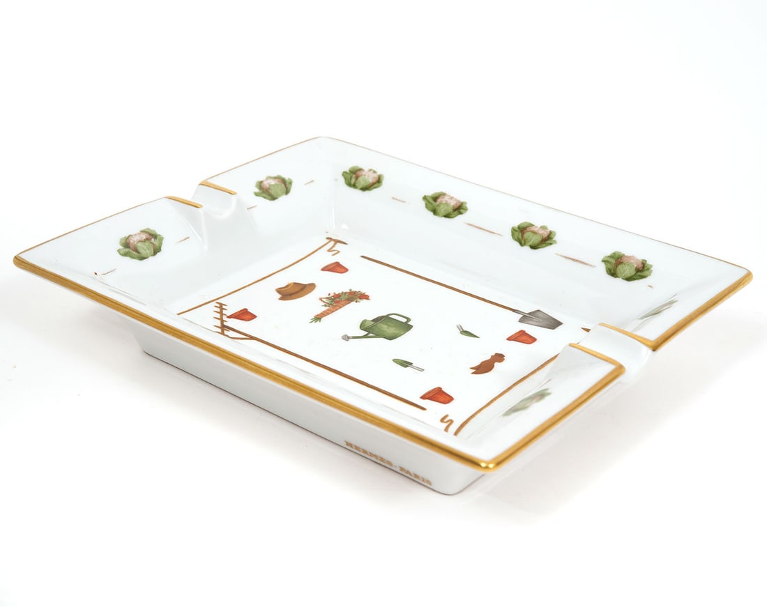 Hermes Garden Theme Porcelain Cigar Ashtray: Hermes garden theme porcelain cigar ashtray. Measures 6.5" x 7.75". Condition report: Good condition, please examine all photos closely. Contact C. Biddle Auction Gallery for more detailed information