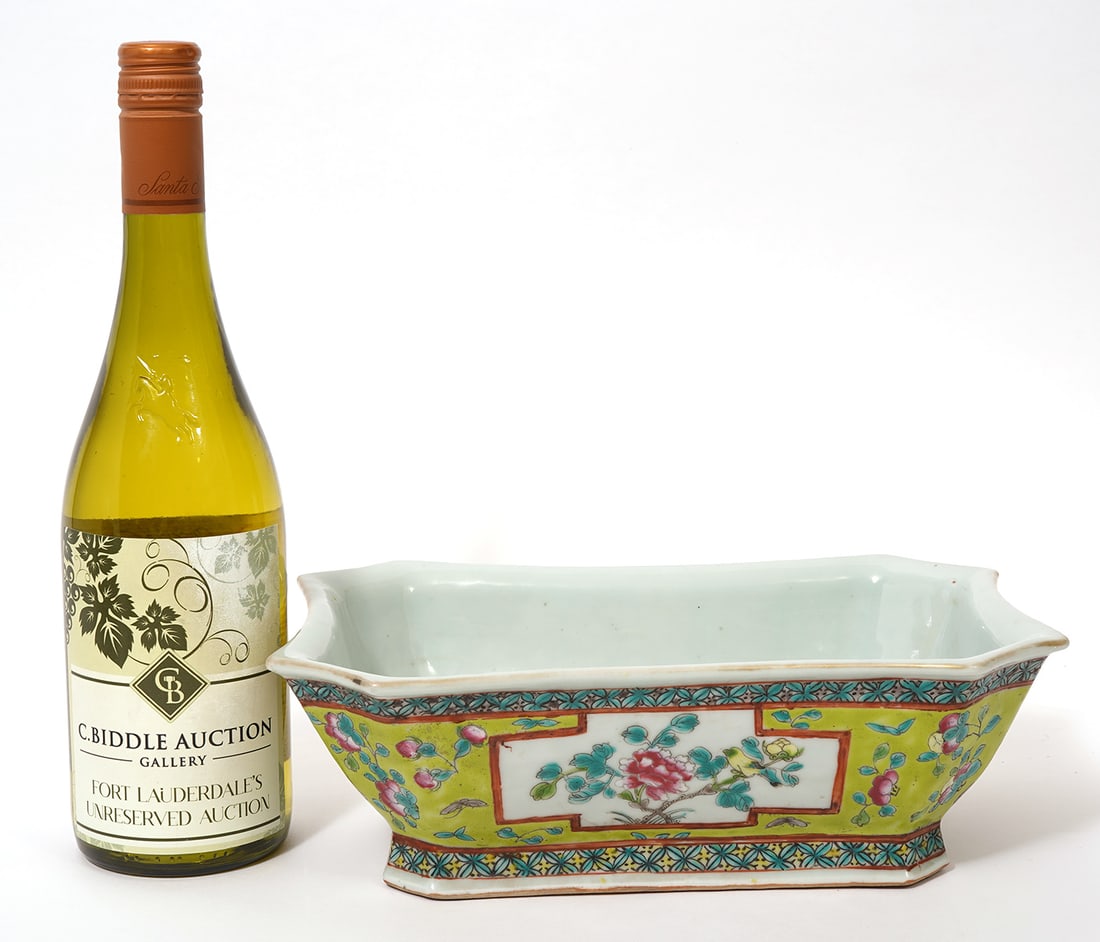 Chinese Famille Rose Green Ground Bowl: Chinese Famille Rose green ground bowl features chamfered corners and vignettes of flowers on each side. Measures 11"L x 7"W x 4.5"H. Condition report: Good condition, please see all photos. Contact C