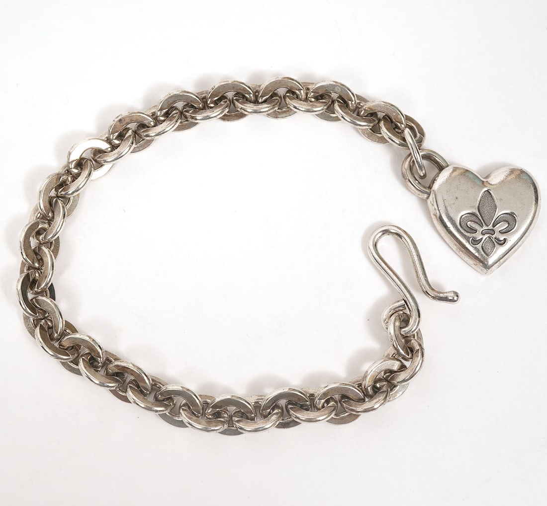 Mignon Faget Sterling Silver Link Heart Bracelet: Mignon Faget sterling silver link bracelet with heart charm. Inscribed with "If I ever cease to love...". Measures approx. 6.5" long and weighs 26.2g. Condition report: Good condition, please examine