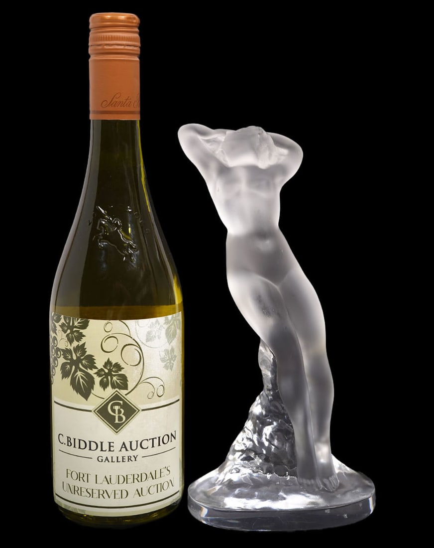 Lalique Crystal Danseuse Bros Leves Dancer: Lalique frosted and clear crystal figurine of a nude female dancer 'Danseuse Bras Leves' was designed by Marc Lalique and issued in 1960. Frosted crystal body on clear oval base is etched 'Lalique Fra