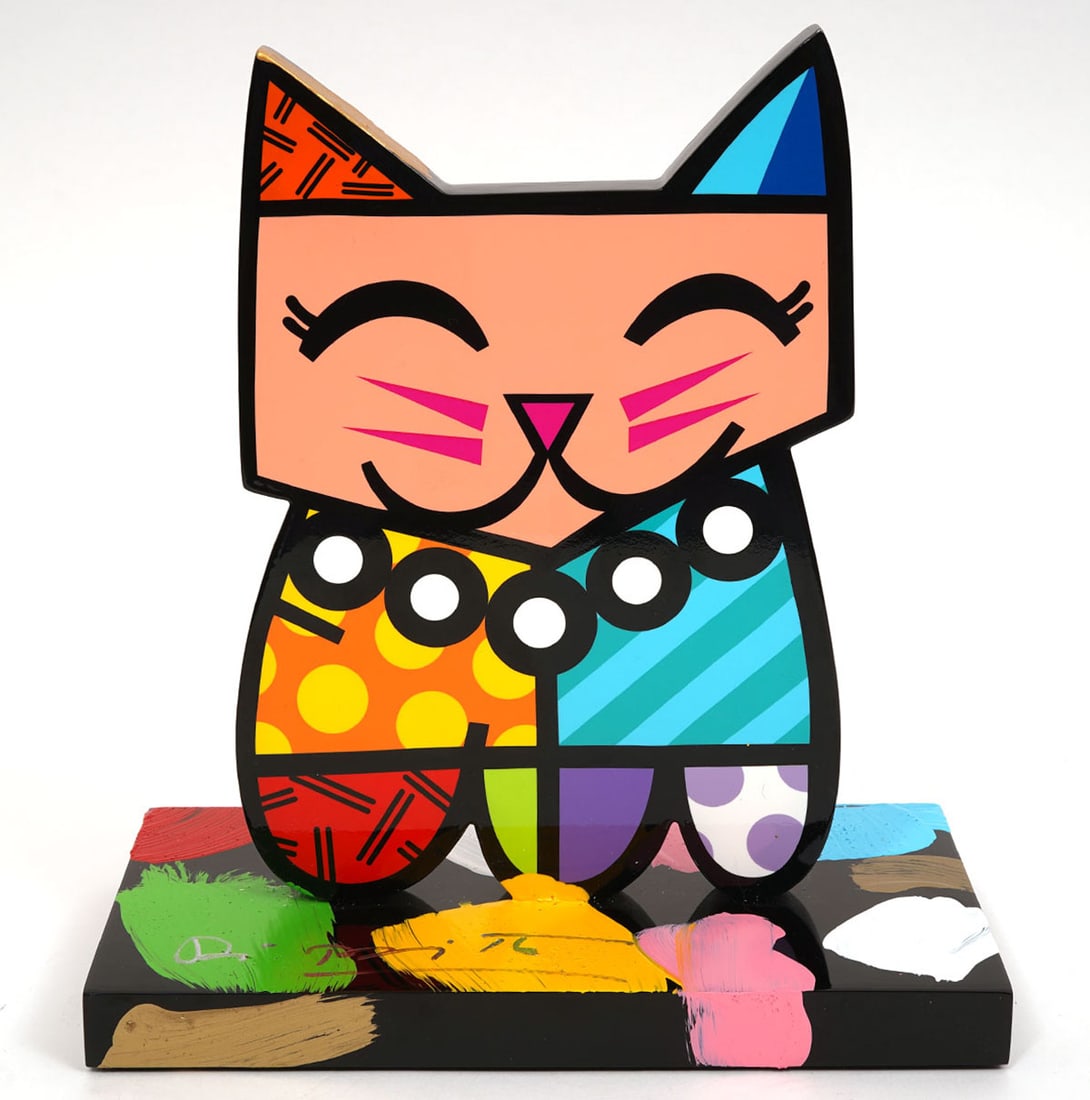 Romero Britto Signed 'Squeaki' Cat Sculpture: Romero Britto, Brazil (Born 1963). 'Squeaki' cat is a poly resin sculpture done with colorful high gloss epoxy paint and varnish on both sides and is signed on the base. Measures 9"H in total; base 8.
