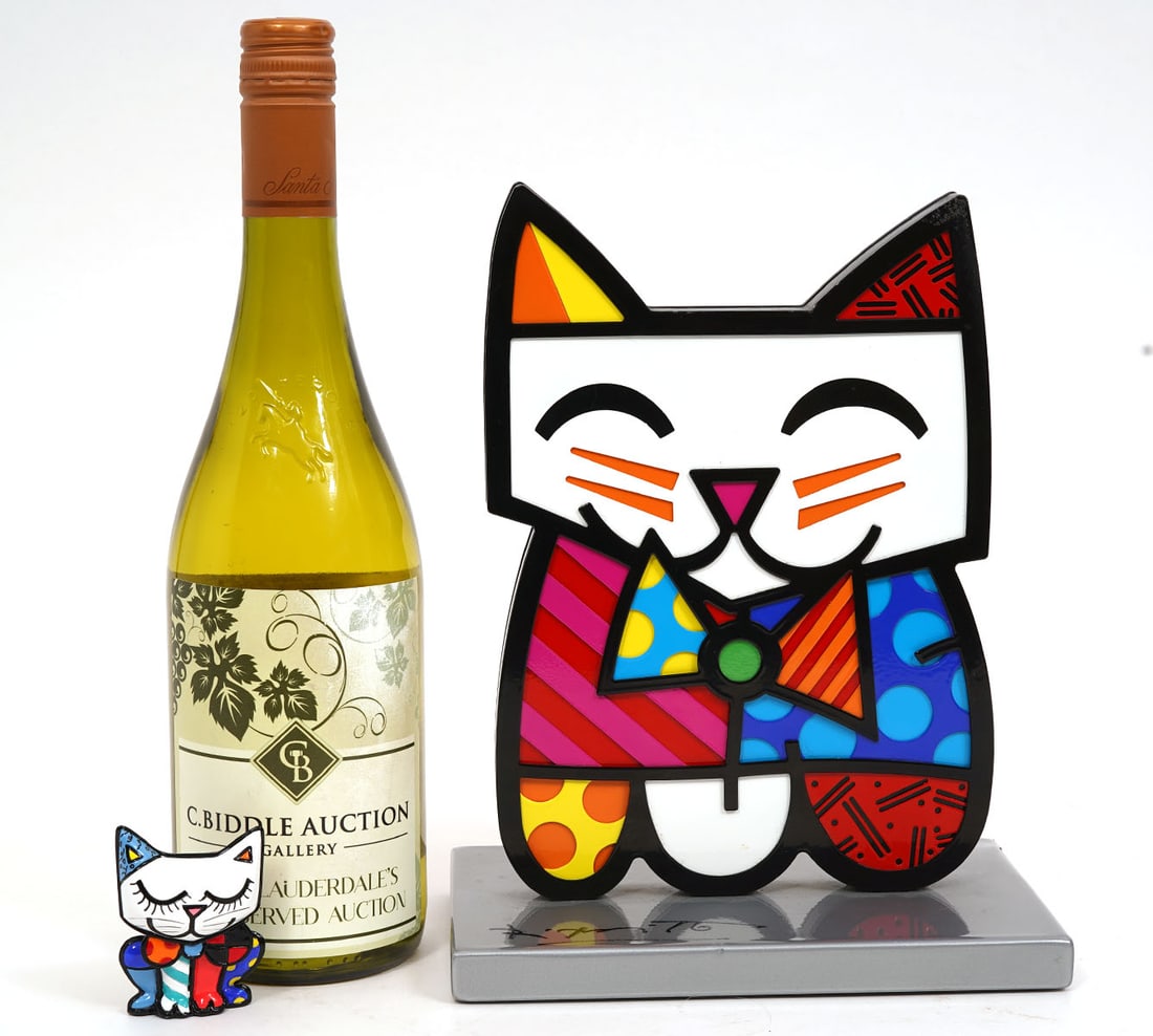 Romero Britto Two 'Squeaki' Cat Sculptures: Romero Britto, Brazil (Born 1963). 'Squeaki' cat sculptures are done with colorful high gloss epoxy paint and varnish on both sides. The larger one is signed on the base and numbered 688/1000. Measure