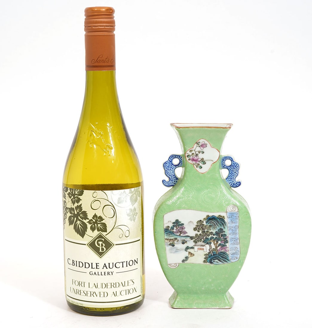 Chinese Porcelain Wall Pocket Vase: Chinese porcelain wall pocket vase decorated in famille style with landscape scene on front and florals on neck, all on green ground with two blue qilin handles. Measures 7 1/8"H x 3.75"W x 1 1/8"D. C