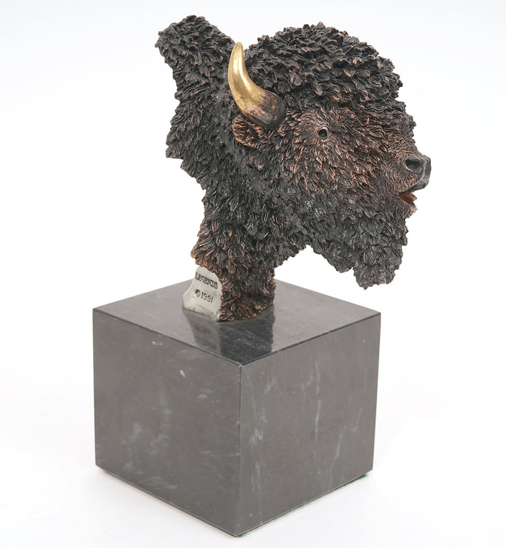 K. Cantrell 'Plains Monarch' Bronze Sculpture: Kitty Cantrell, American, 20th C. Bronze buffalo head sculpture mounted on marble base titled 'Plains Monarch' and numbered 507/950 and inscribed 'K. Cantrell', 'Legends 1991' and 'USA'. Measures 8"H