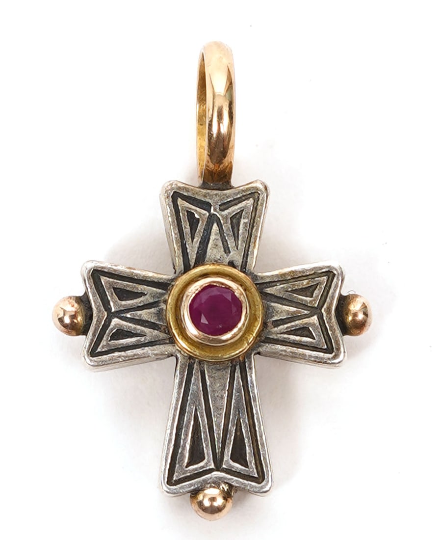 Konstantino Sterling and Gold Cross: Konstantino sterling and gold cross with ruby stone in center, marked on back. Measures 5/8"L (.75" drop) x .5"W and weighs 2.8 grams. Condition report: good condition, please see all photos. Contact