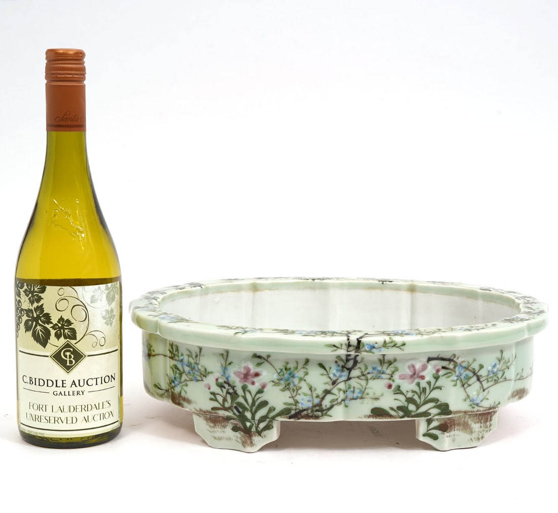 Vintage Ceramic Oval Serving Dish: Vintage ceramic serving dish is hand painted with floral motifs in blues and trailing vines on white ground, has a scalloped flat rim and is raised on 4 decorative feet. Measures 13.5"L x 10"W x 3.75"