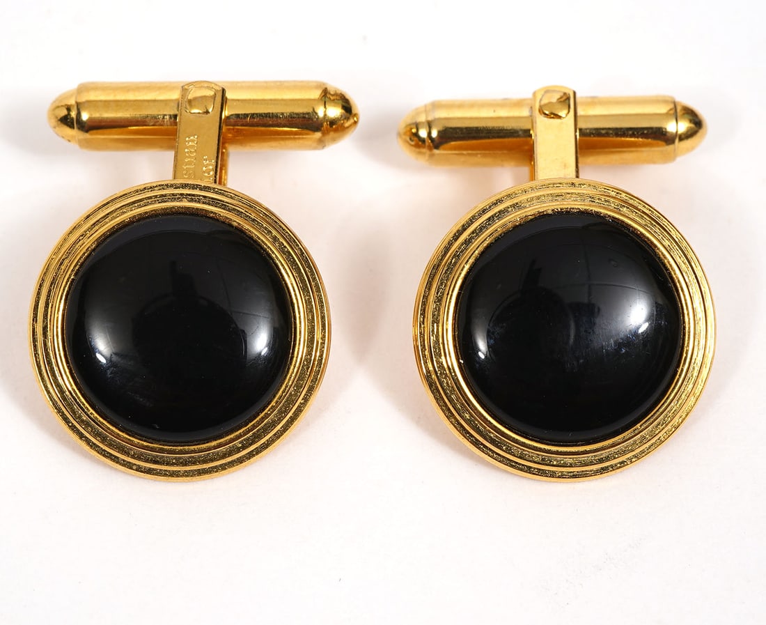 Christian Dior Gold Tone Cufflnks: Pair of Christian Dior gold tone cufflinks with circular black stones and marked 'Christian Dior' on the post. Condition report: good condition, please see all photos. Contact C. Biddle Auction Galler